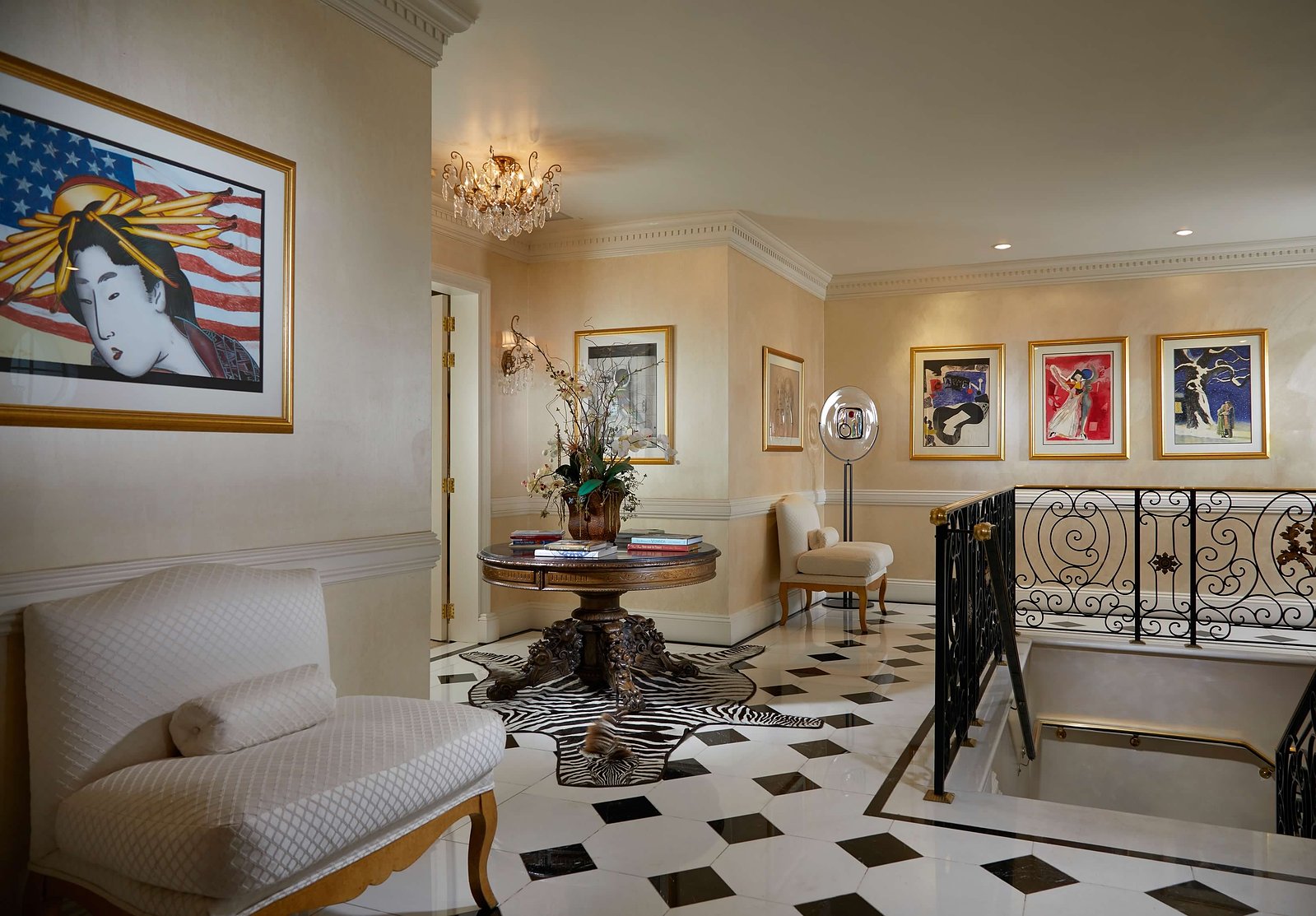 A sophisticated blend of art, rich textures, and architectural details create an inviting upstairs landing.