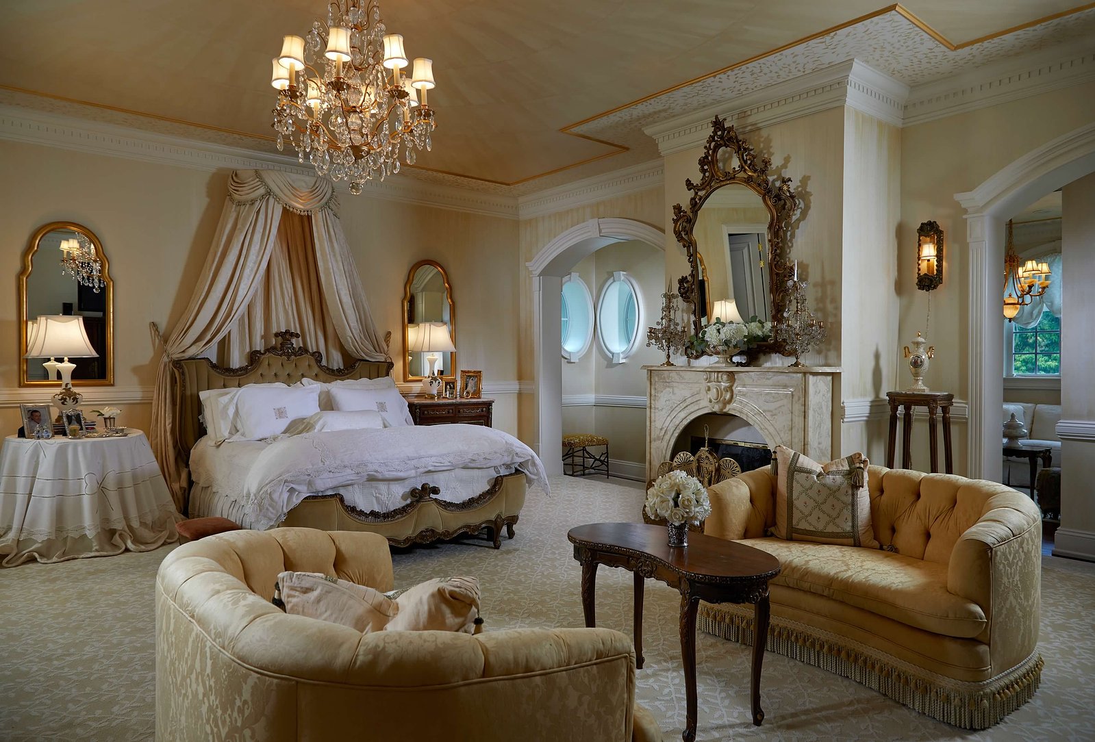 A symphony of gold, crystal chandeliers, and rich textures define this refined living space.