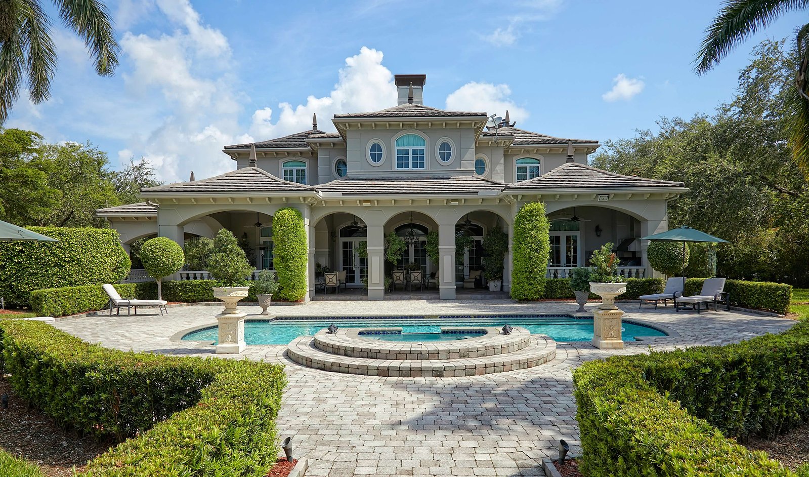 French architectural charm meets tropical beauty in this breathtaking estate