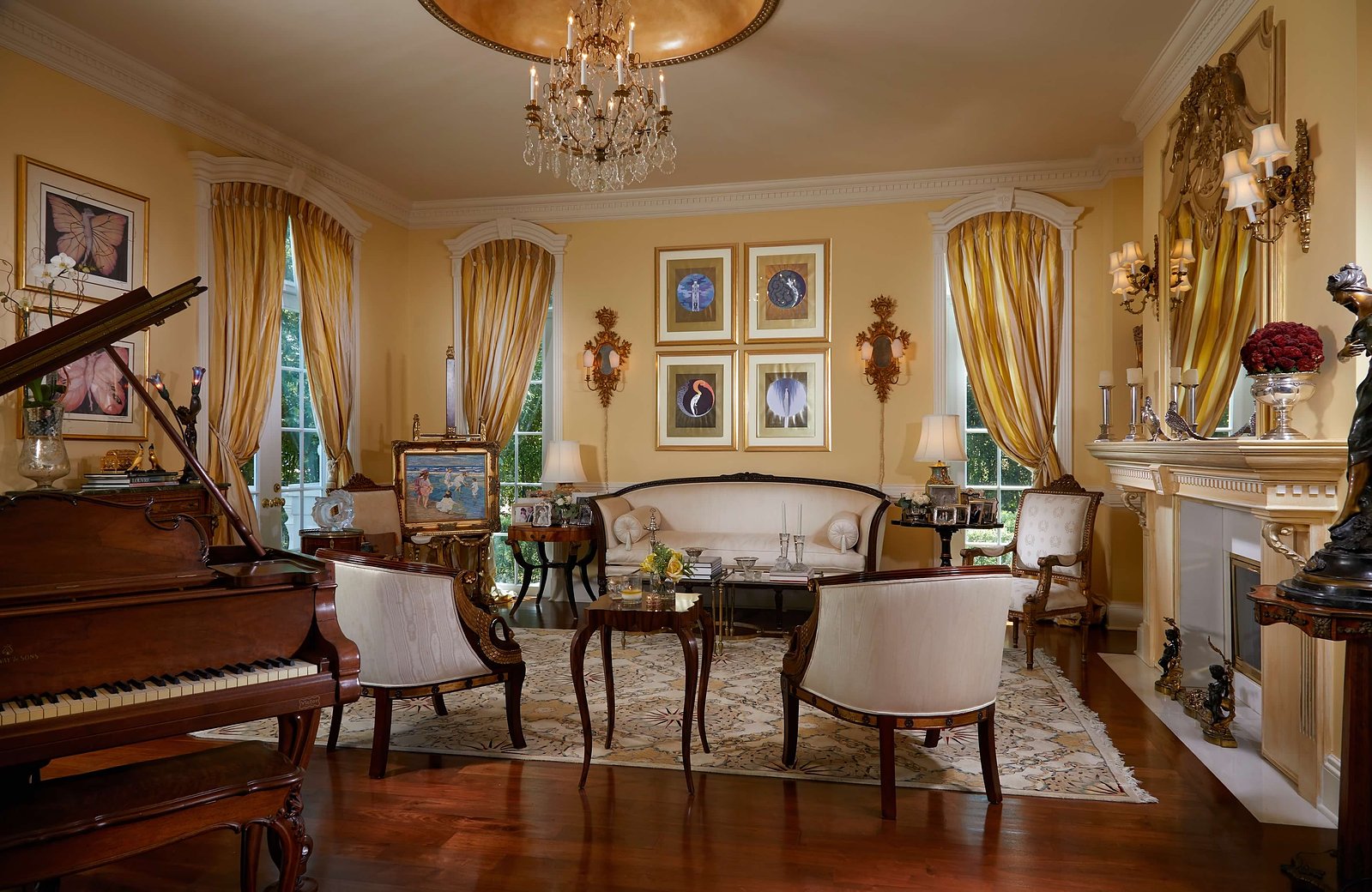 A symphony of gold, crystal chandeliers, and rich textures define this refined living space.