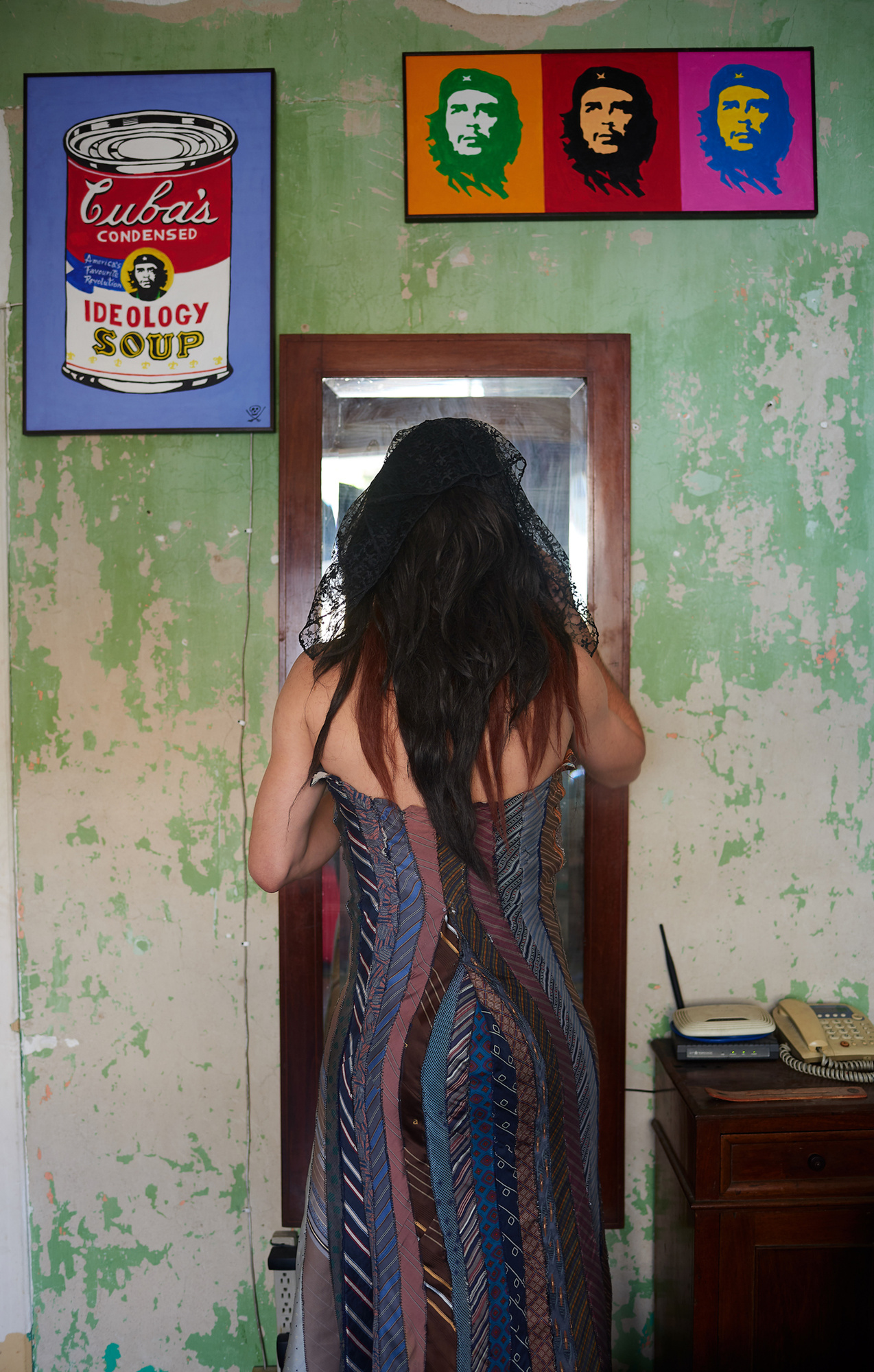 CARACAS, VENEZUELA - JULY 5, 2019. Eduardo stands in front of his mirror, preparing his drag in his apartment. Eduardo created Amala specifically as a way to promote the peoples’ political rights and collective well-being, wo