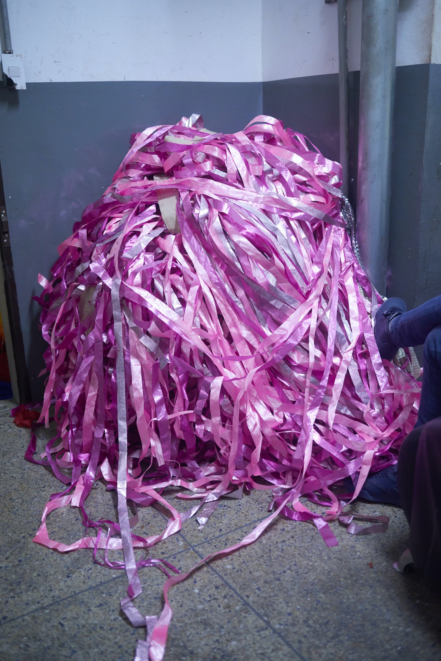 CARACAS, VENEZUELA - FEBRUARY 23, 2020. The curtain tassels are balled up in the corner of the dressing room of the club. Performers tend to spend the night, drinking and chatting in the dressing room after the club closes.
