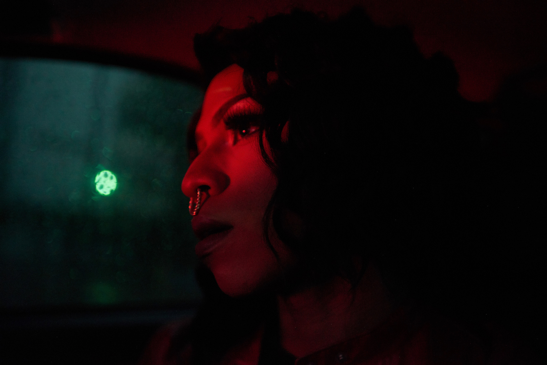CARACAS - JULY 30, 2019.
Daniel - dressed in full drag as Miranda - in a cab on his way to the drag club in Altamira. He, like other drag queens, work nights. Often the daily routine is to sleep a few hours after getting home from the club, rehearse and g