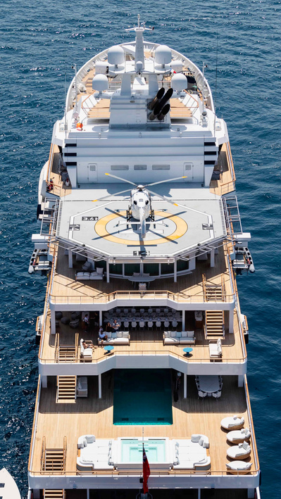 Aerial top view from helicopter of a yacht with helicopter on the deck in Saint-Tropez, South of France.