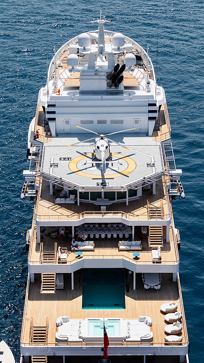 Aerial top view from helicopter of a yacht with helicopter on the deck in Saint-Tropez, South of France.