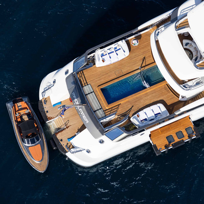 Aerial view from helicopter of a yacht with annex and toys in Saint-Tropez, South of France.