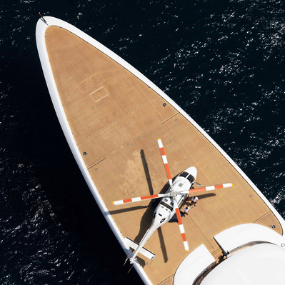 Aerial top view from helicopter of a yacht with helicopter on the deck in Saint-Tropez, South of France.