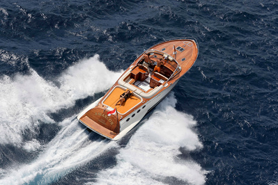 Aerial view from helicopter of a girl in bikini on a yacht in Saint-Tropez, South of France.