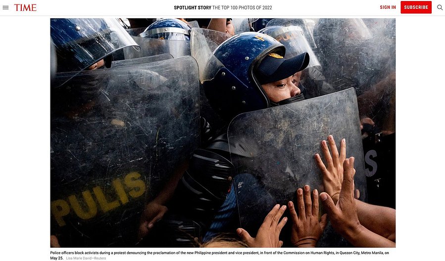 Police officers block activists during a protest denouncing the proclamation of the new Philippine president and vice president, in front of the Commission on Human Rights, in Quezon City, Metro Manila, on May 25. Lisa Marie David—Reuters