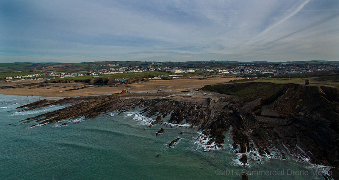 Aerial image of Bude, Cornwall. Drone shot of ocean, cliffs, sea and North Cornish coastline. Showing surf off Summerleaze and Crooklets beaches, also shows Compass Point. Drones Bude, Cornwall