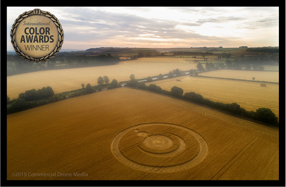 Aerial photograph of crop circle in corn fields, landscape composition. Winning image given Honourable Mention at 13th International Color Awards in Beverley Hills.
