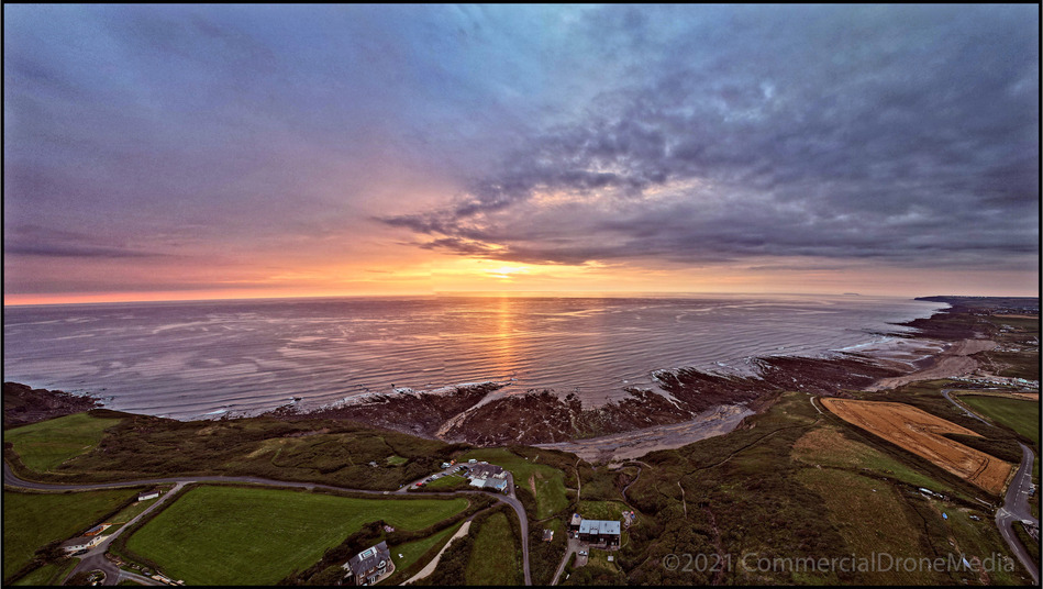 Vivid colours of sunset beyond Widemouth Bay and Wanson beaches near Bude, Cornwall. Aerial image captured by drone.
Atlantic coast and cliffs of Kernow. Lundy Island visible on the right hand horizon.