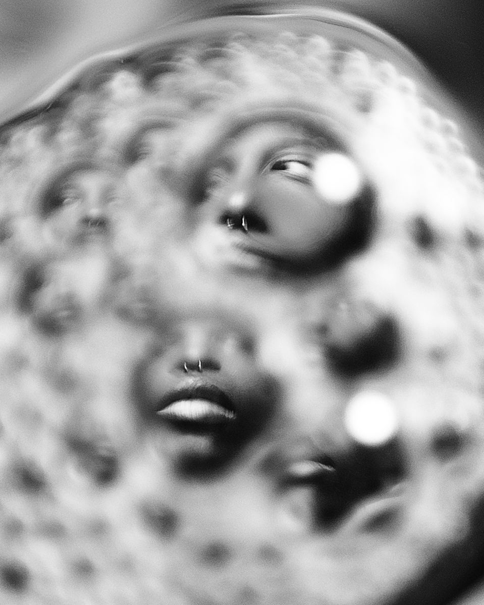 Photograph distorted through soap bubbles by Rielle Oase