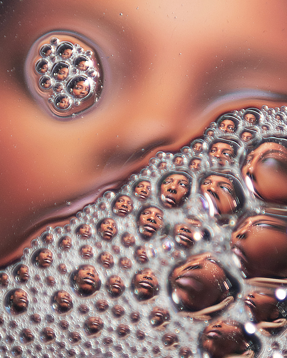 Photograph distorted through soap bubbles by Rielle Oase
