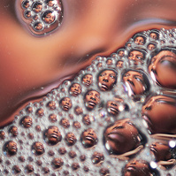Photograph distorted through soap bubbles by Rielle Oase