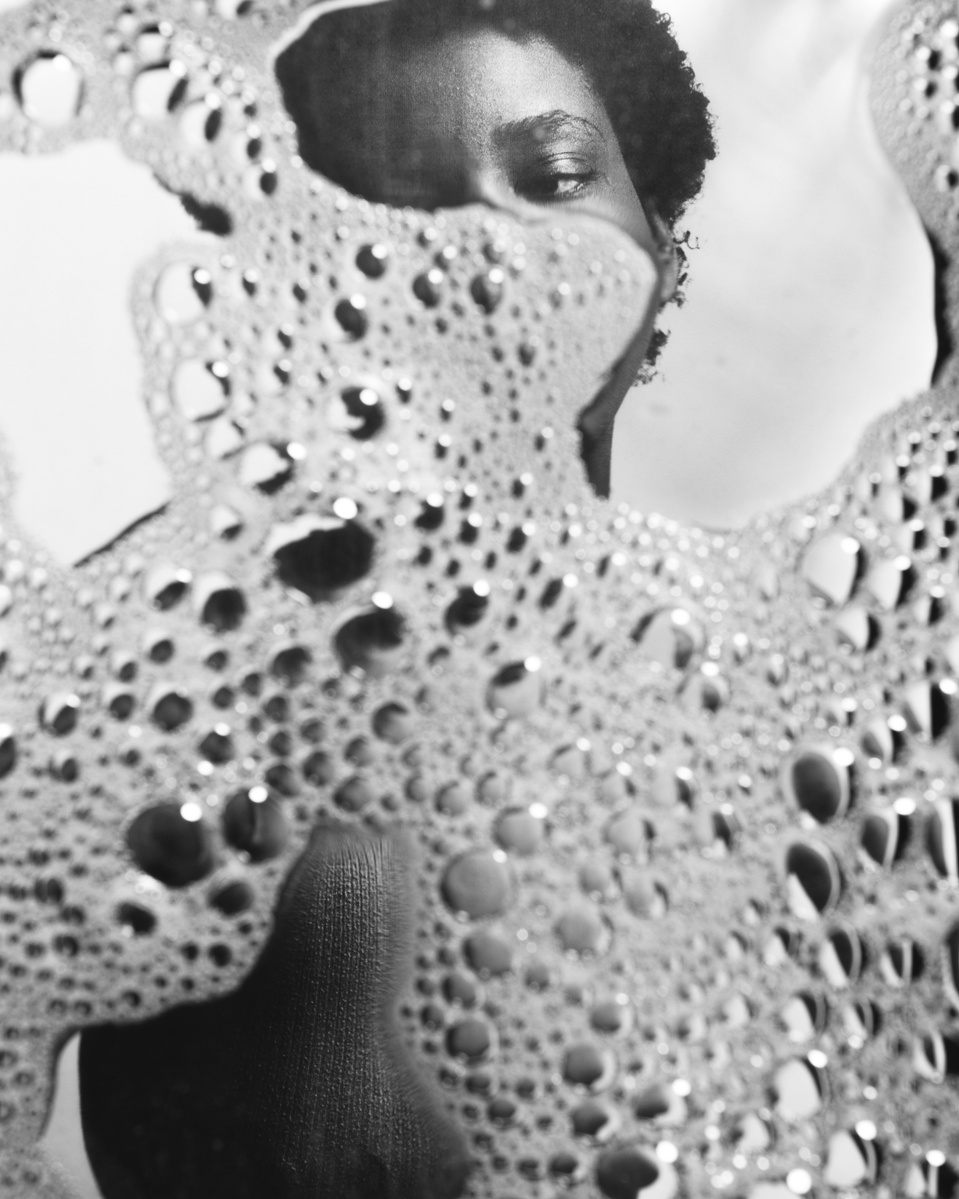 Photograph distorted through soap bubbles by Rielle Oase