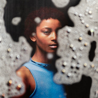 Photograph distorted through soap bubbles by Rielle Oase
