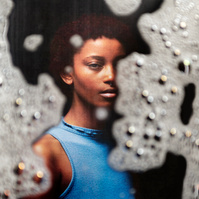 Photograph distorted through soap bubbles by Rielle Oase