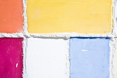 A water color architectonic wall hung relief sculpture made of cast concrete with white plaster