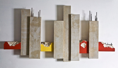 An architectonic cubic sculpture made of cast concrete with smashed parts. Mild steel is part of the construction.
