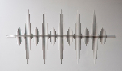 A waveform sculpture made out of rods of stainless steel.
