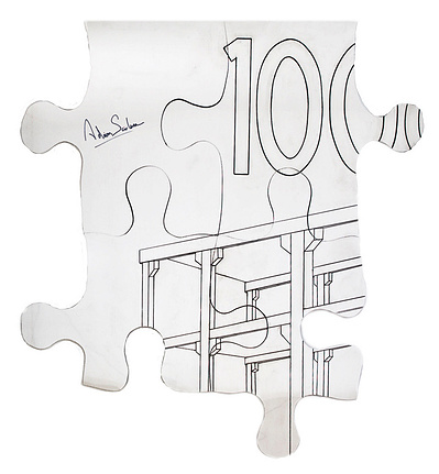 A wall hung sculpture made of aluminum forms 4 pieces of an oversized jigsaw puzzle with a painted drawing of a building construction on it.
