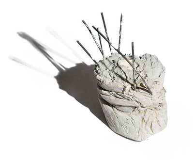 Concrete debris forms a cast debris sculpture.