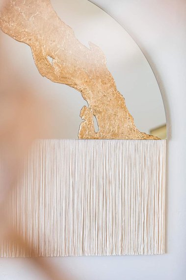 Hanging mirror with gold and fringe by Candice Luter