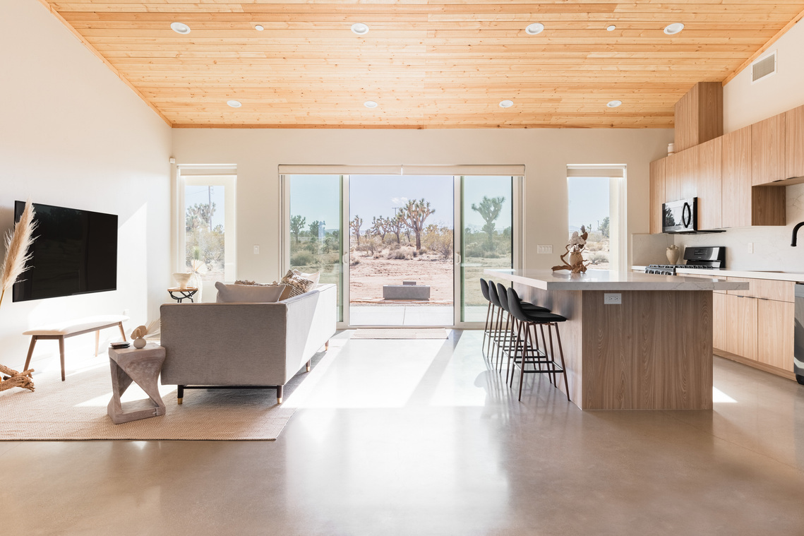 Open living room dining area with desert views in Yucca Valley CA at Lazy Sunday House