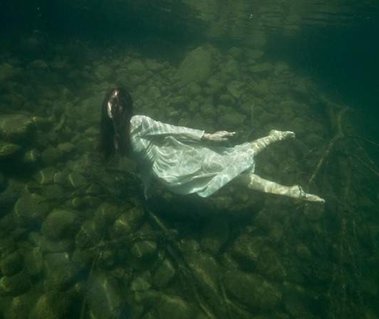 Photograph of Anima May's natural lake underwater interpretation performance, Lychen, Germany