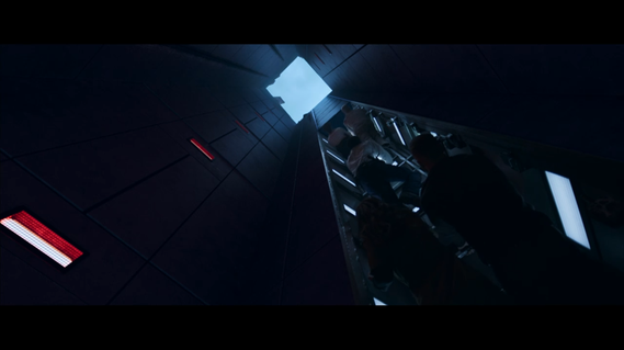 2 actors are climbing their way out of an elevator shaft and can see open sky above them. lighting details show some ladder details.