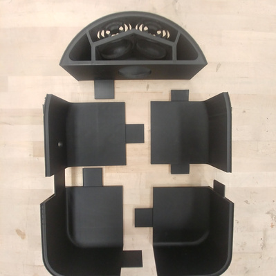 5 sections of 3D printed casing lying on a table