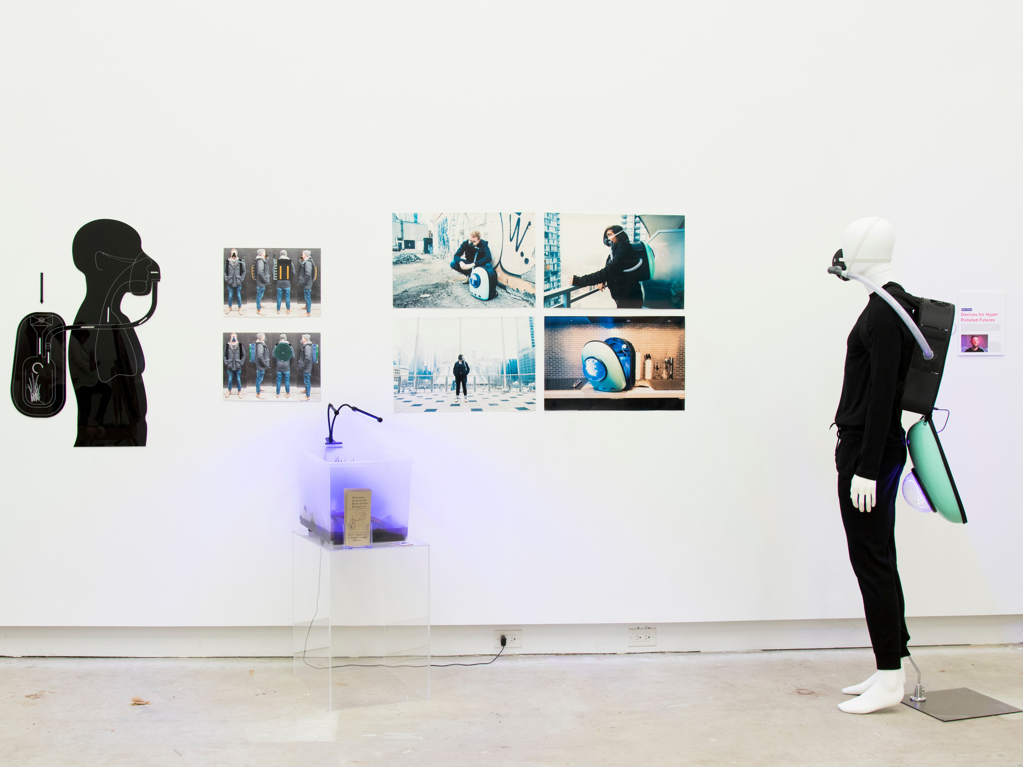 Art installation in a gallery. Includes an acrylic infographic of how the deceive works, a series of photos of the device being used, some examples of other prototypes as renders, a sample of the ecosystem and a mannequin wearing the device.