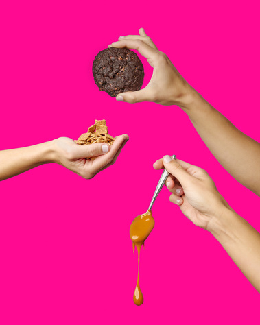 Three hands in frame holding Cinnamon Toast Crunch and dulce de leche cookie and relevant ingredients. Fuschia background. Image shot by Megan Morello, San Diego and Southern California Food and Photographer.