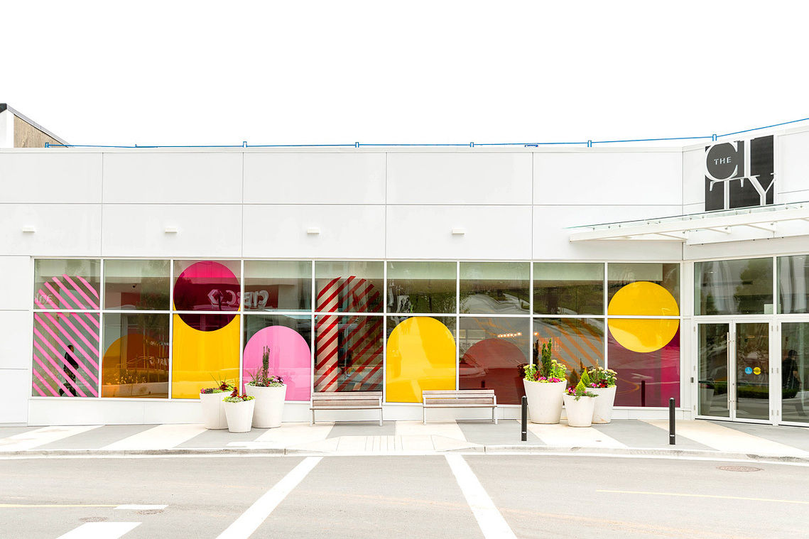 Window decals featuring colorful geometric designs by Annie Chen.