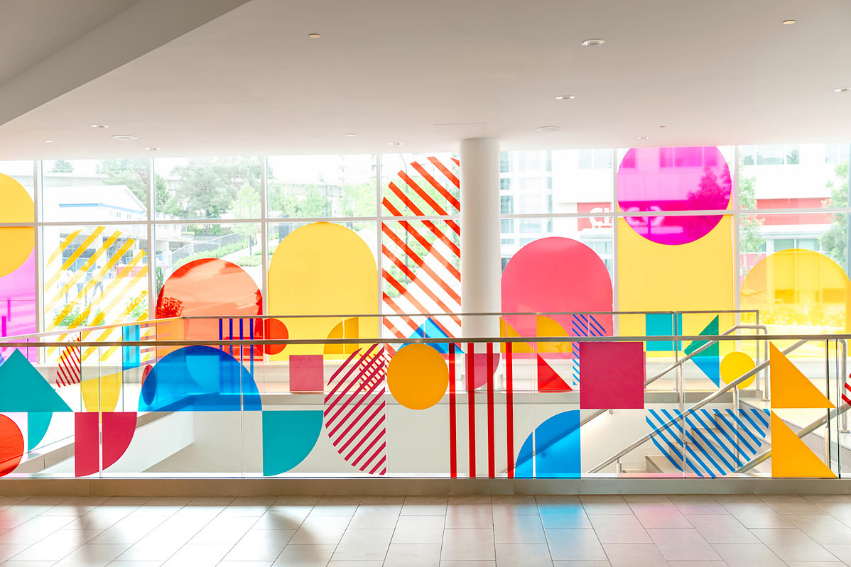 A vibrant vinyl installation featuring colorful geometric designs by Annie Chen.
