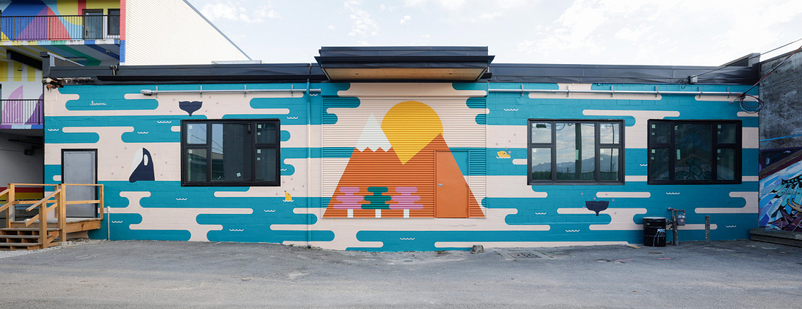 A vibrant mural of geometric designs featuring nature and wildlife in BC.