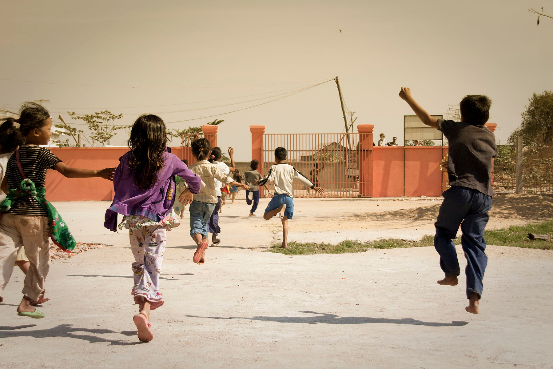 Article 13: "Every child shall have the right to freedom of expression; ... either orally, in writing or in print, in the form of art, or through any other media of the child's choice. Child garbage pickers run after an aid truck, Stung Meanchey Waste D