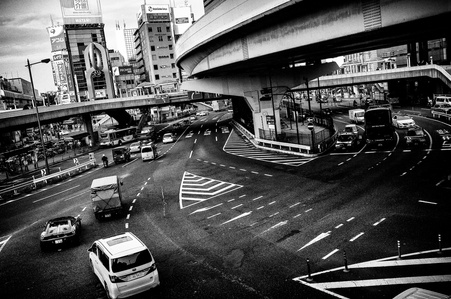 Walking on bridge in Tokyo center and watching car traffic.