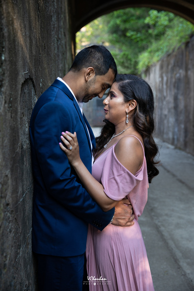 Couple engagement session where couple poses facing each with forehead touching