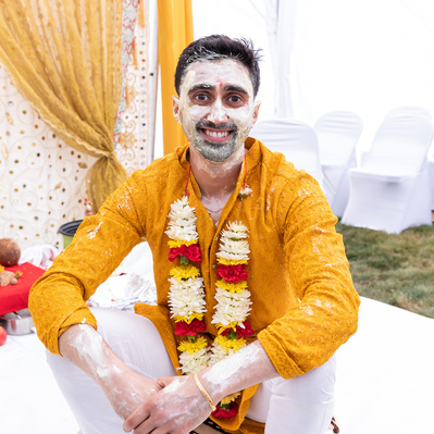 groom poses during haldi ceremony