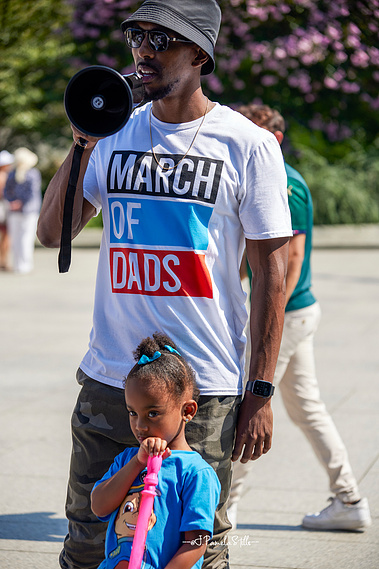 Johnny Bailey, who brought his first-born daughter Alexandria, addresses the marchers.  Bailey reminded the fathers wherever they are in their dad journey, their presence is needed.   