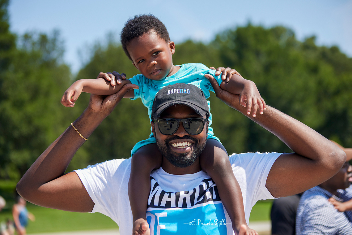 Edward Smith, III, The Dad Gang COO, enjoying father-time with 2 year old son Edward Smith IV.  Smith says he loves being a dad; it’s the one job he can’t get fired from.   