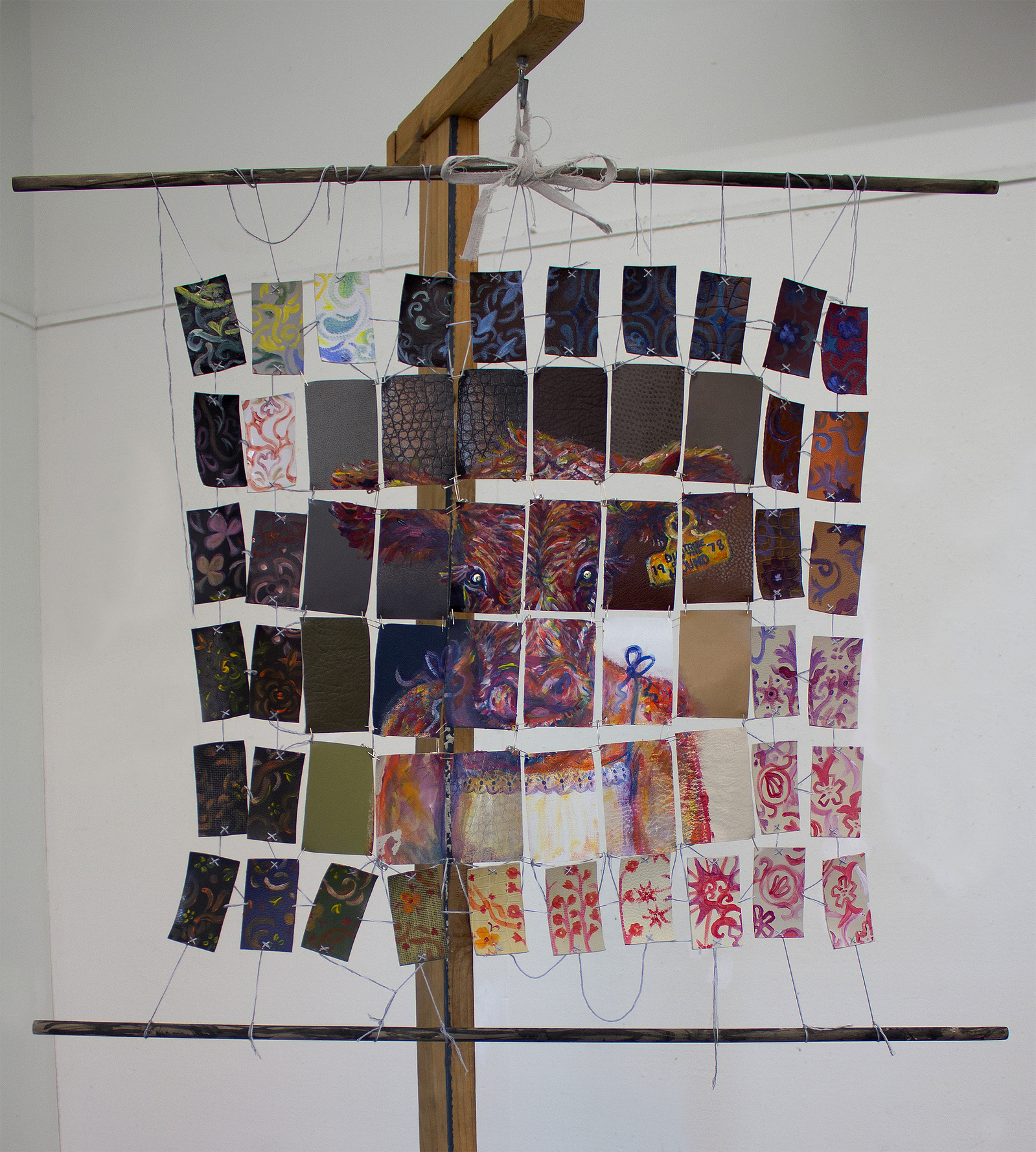 colorful little cow girl portrait on strung together pieces of pleather