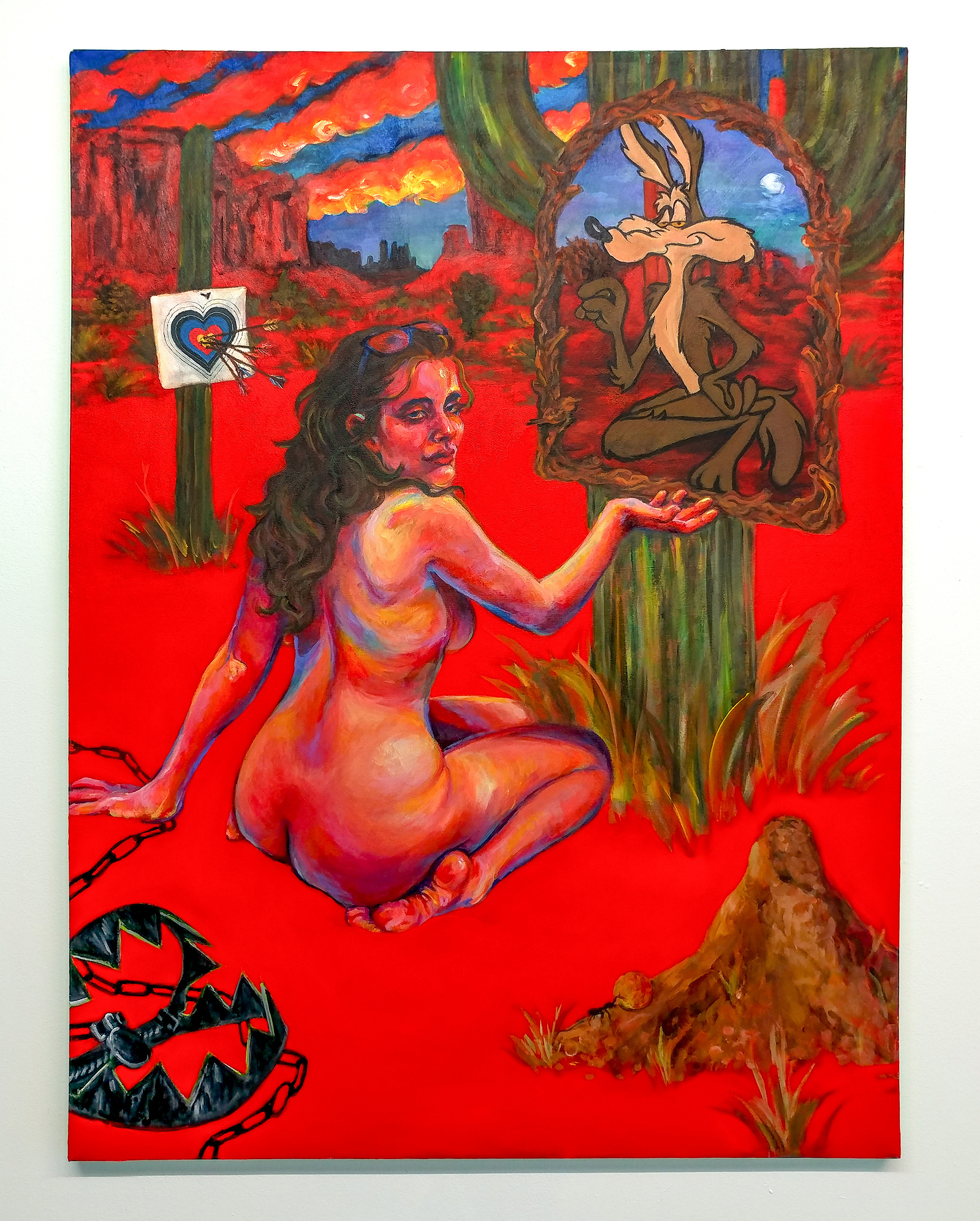 Nude woman surrounded by cartoon traps in the desert with Wile E. Coyote