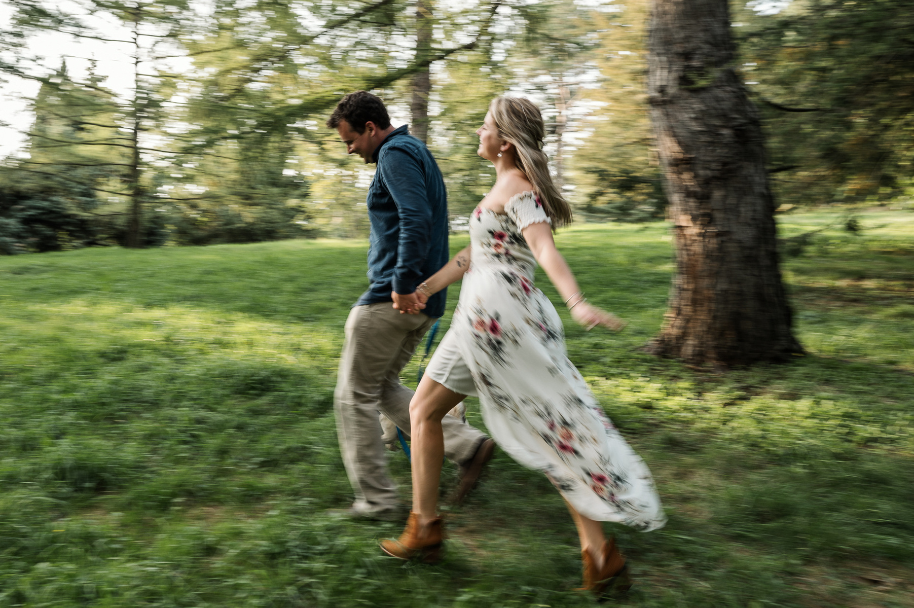 a couple runs through the arnold arboretum during their boston engagement session