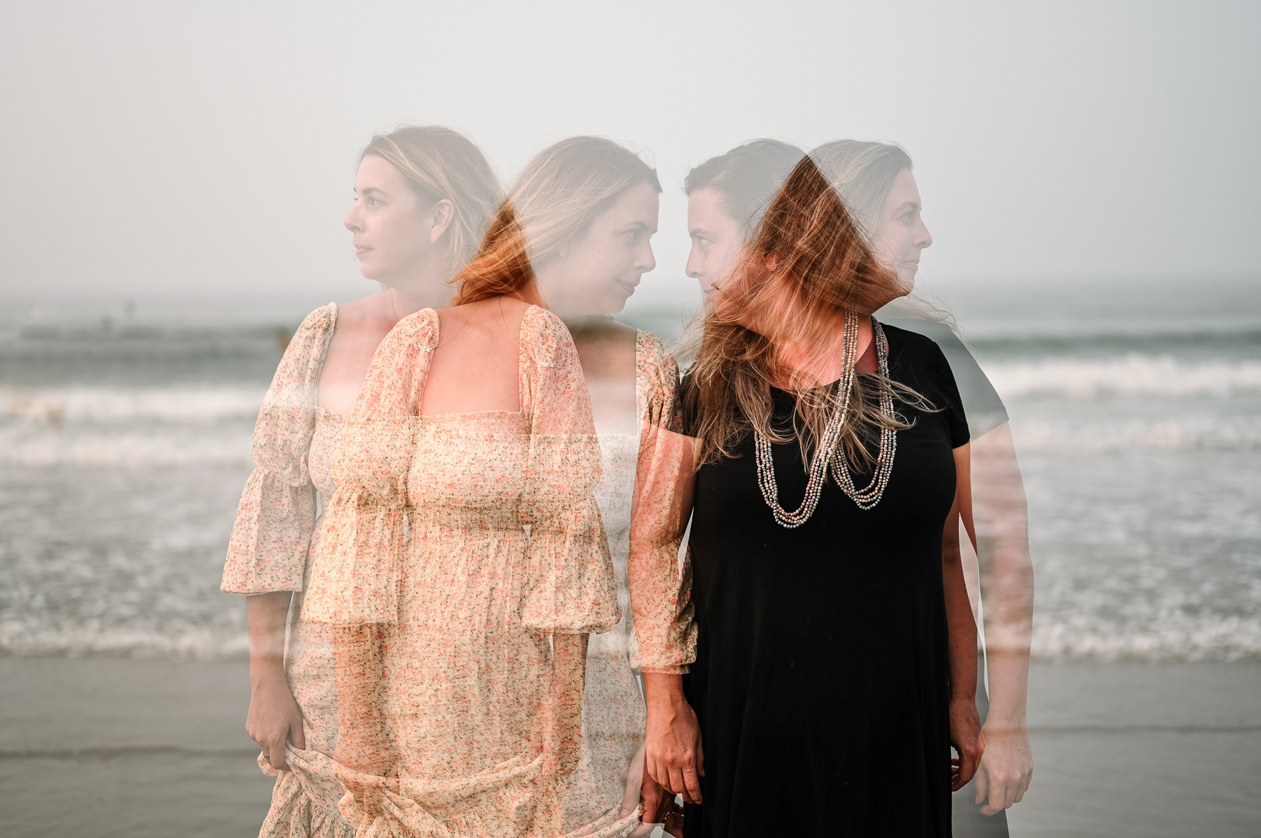 A double exposure of two female sisters on Nantasket Beach at their Hull family photography session by Korri Leigh Photography
