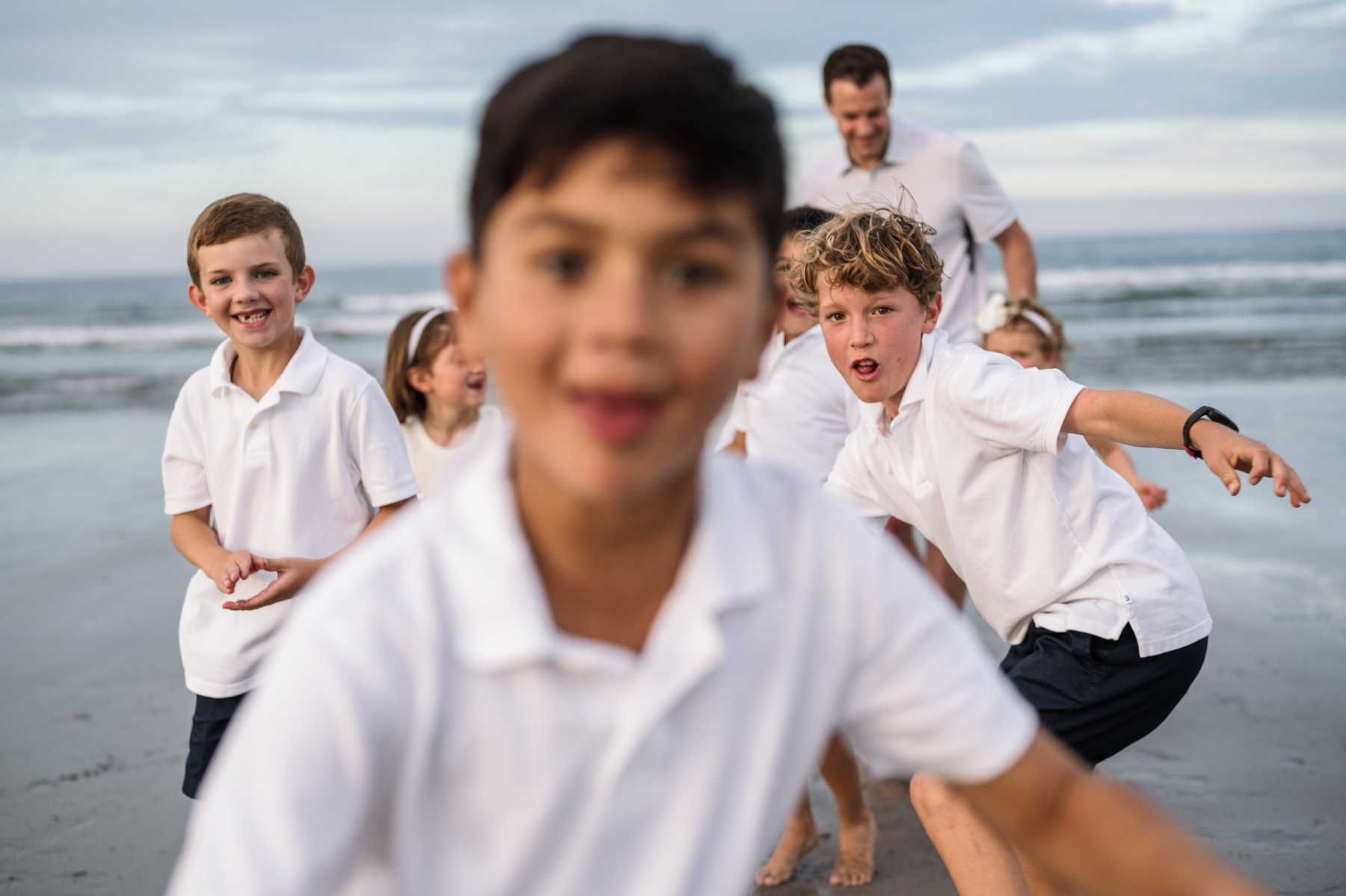 Silliness during an extended family photo session with Grandparents at Nantasket Beach in Hull MA by Boston family photographer Korri Leigh Crowley