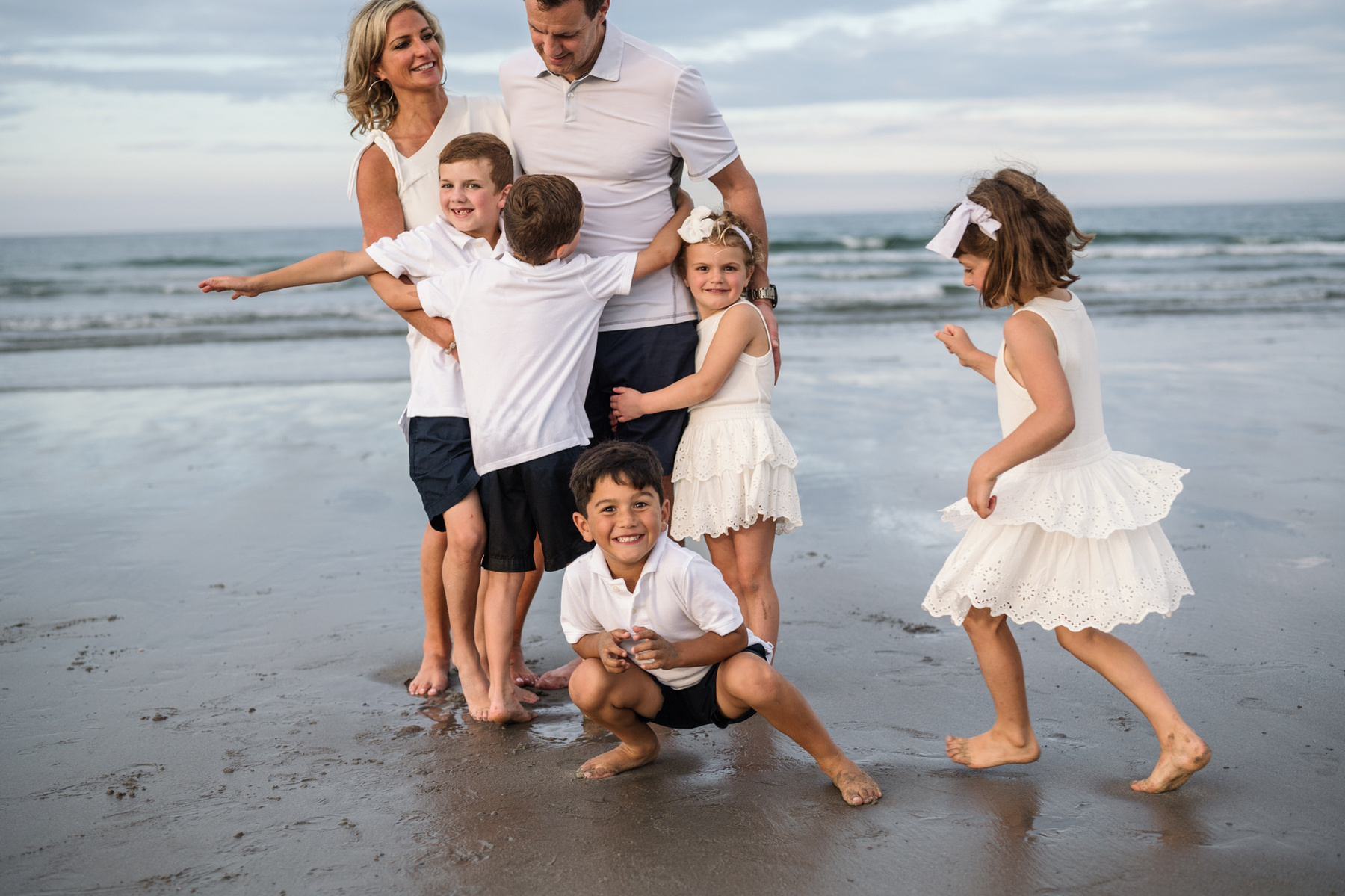 Chaos during an extended family photo session with Grandparents at Nantasket Beach in Hull MA by Boston family photographer Korri Leigh Crowley