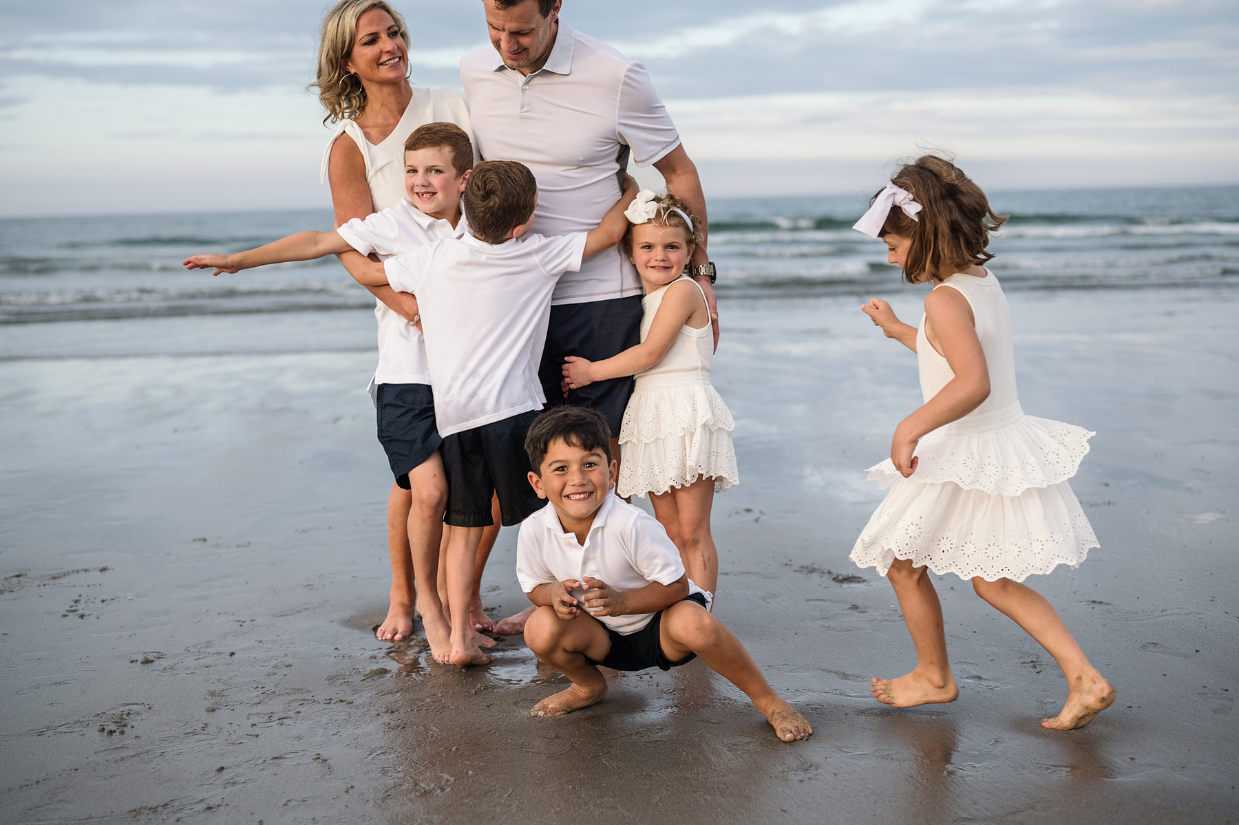 Chaos during an extended family photo session with Grandparents at Nantasket Beach in Hull MA by Boston family photographer Korri Leigh Crowley